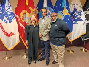 Judge Halee Weinstein with Veterans Court Graduate Eric Brown and mentor Tyrone Bonds